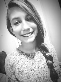 Portrait of smiling young woman at home