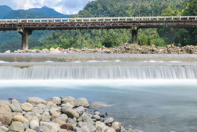 Scenic view of river flowing through dam