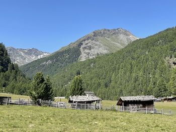 Scenic view of mountains against clear blue sky