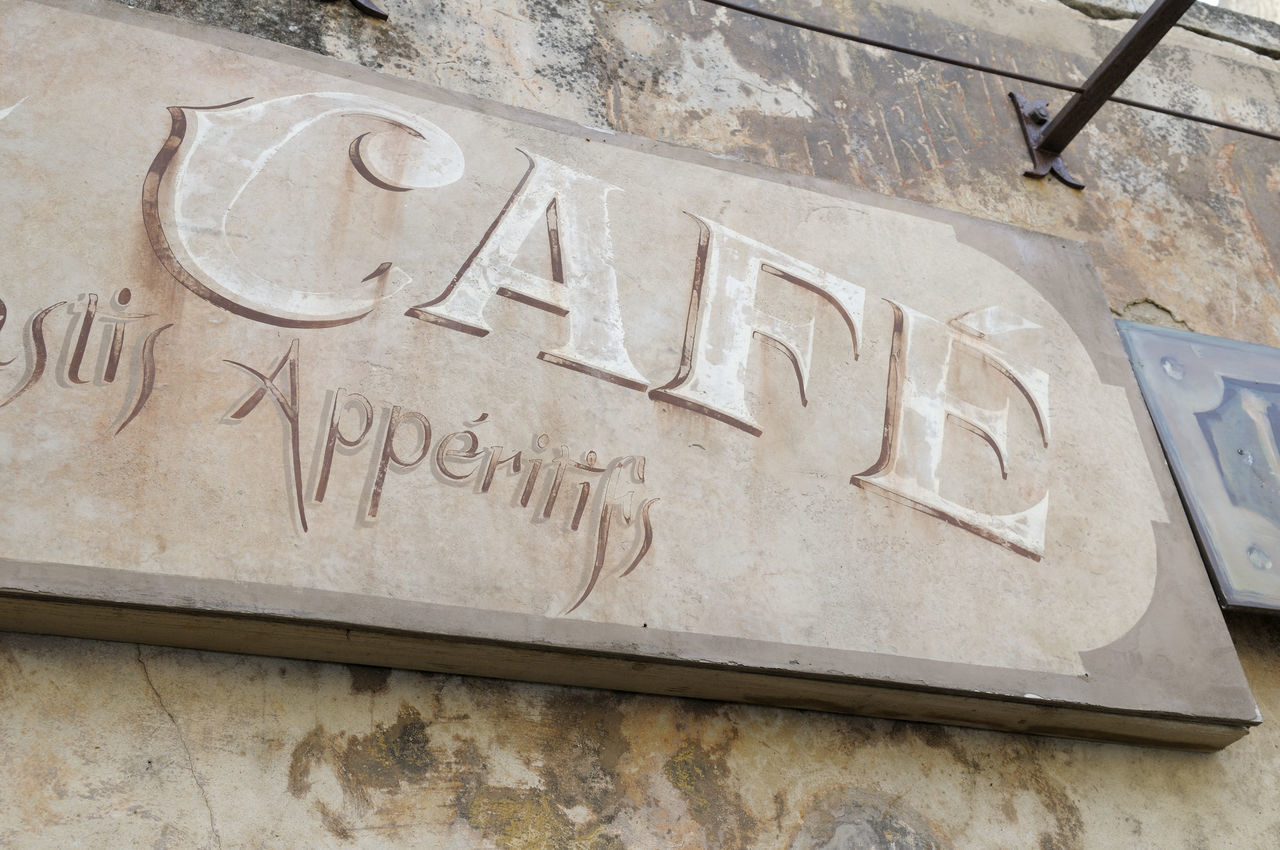 HIGH ANGLE VIEW OF SIGN ON WALL