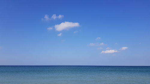 Scenic view of sea against blue sky