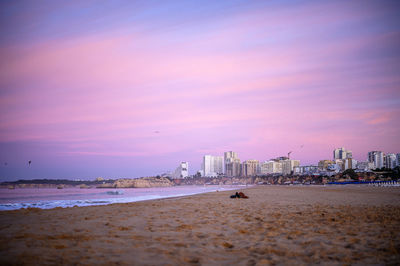 Scenic view of beach against sky during sunset in portimao