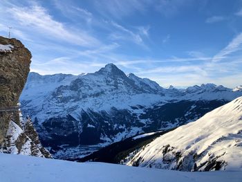 Scenic view of snowcapped mountains against sky