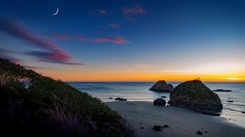 Scenic view of sea against sky during sunset