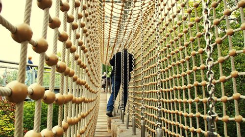 Close-up of ropes hanging on metal structure