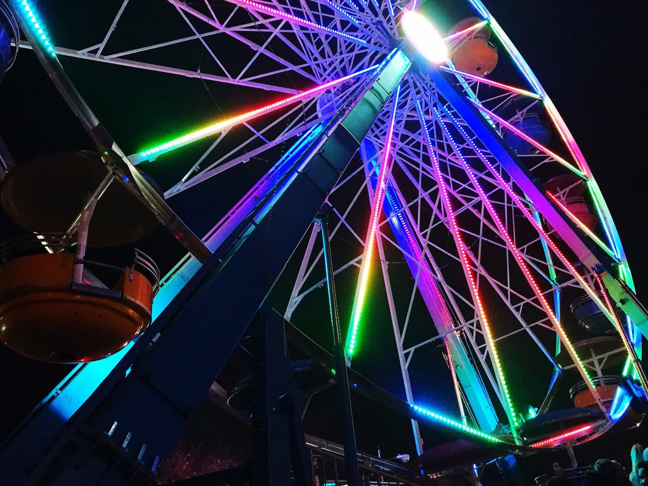 LOW ANGLE VIEW OF ILLUMINATED FERRIS WHEEL