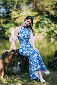 Young woman standing on rock