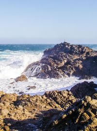 Scenic view of sea against clear sky