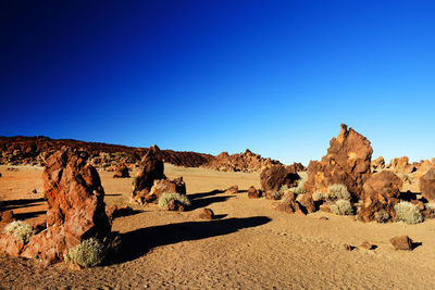 Rocks at el teide national park against clear blue sky