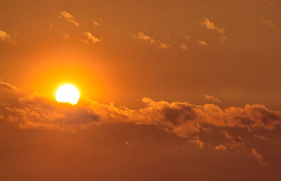 Low angle view of cloudy sky at sunset