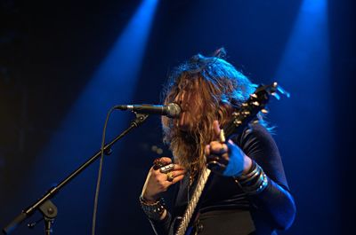 Low angle view of person playing at music concert