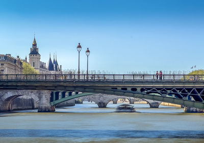 Bridge over river against clear sky