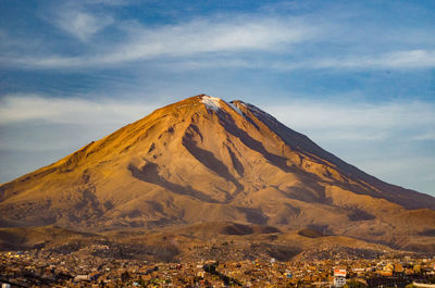 Scenic view of mountain against cloudy sky