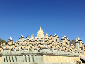 Low angle view of cathedral against clear blue sky