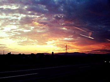 Silhouette of landscape against dramatic sky