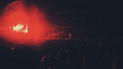 People enjoying concert at night