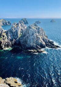 Panoramic view of sea against blue sky