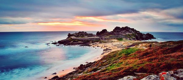 Scenic view of sea against cloudy sky