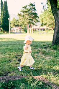 Full length of woman on field