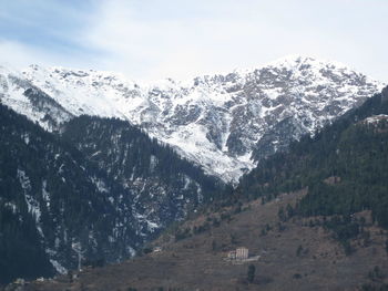 Scenic view of mountains against sky during winter