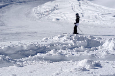 Full length of man skiing on snow land