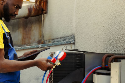 Side view of man working at home