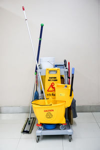 View of yellow toys on floor against wall