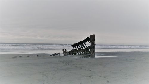 Scenic view of shipwreck against sky