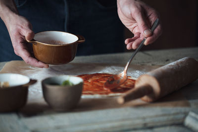 Close-up of human hands preparing food