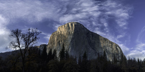 Low angle view of rock formation against sky