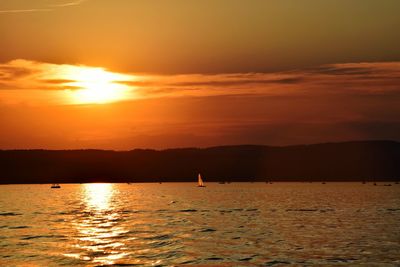 Scenic view of sea at sunset