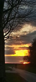 Scenic view of road at sunset