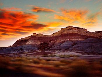 Scenic view of mountain against dramatic sky