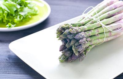 High angle view of vegetables in plate on table