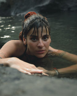 Portrait of woman swimming in lake