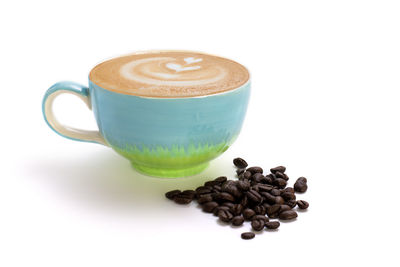 Close-up of coffee cup against white background