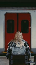 Rear view of woman in train