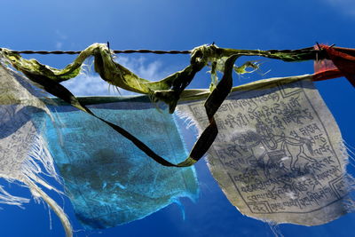 Low angle view of prayer flags against sky