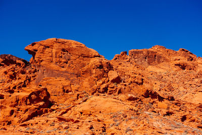 Low angle view of rock formation against clear sky at valley of fire state park