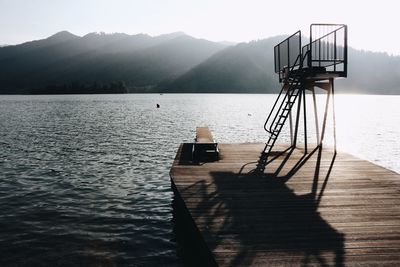 Pier over lake against sky