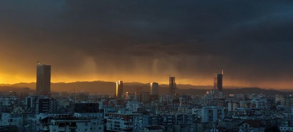 Tirana by night rain sunset  building