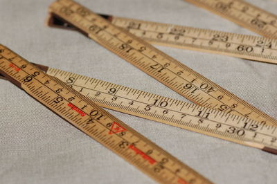 High angle view of tape measure on fabric