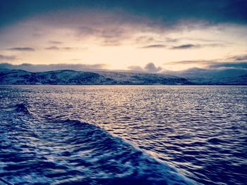 Scenic view of sea against sky at sunset