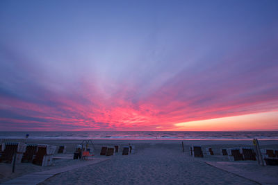View of beach against sky during sunset