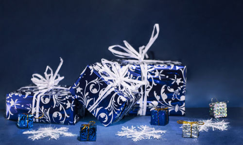 Christmas decorations on table against black background