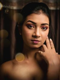 Close-up of young woman at home