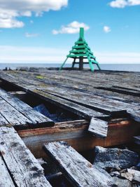 View of pier on sea against sky