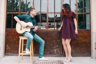 Young woman playing guitar