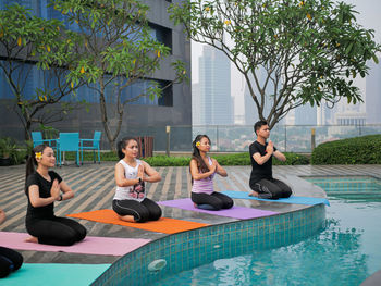 People sitting in swimming pool