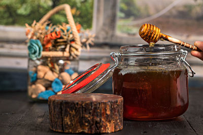 Close-up of glass jar on table